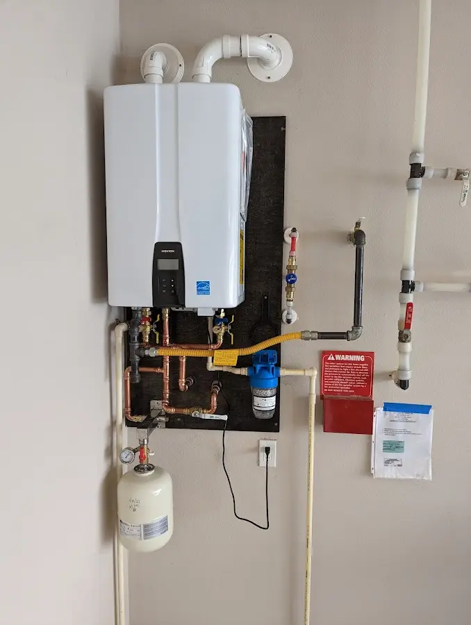 Professional plumber installing copper piping in a Los Gatos home